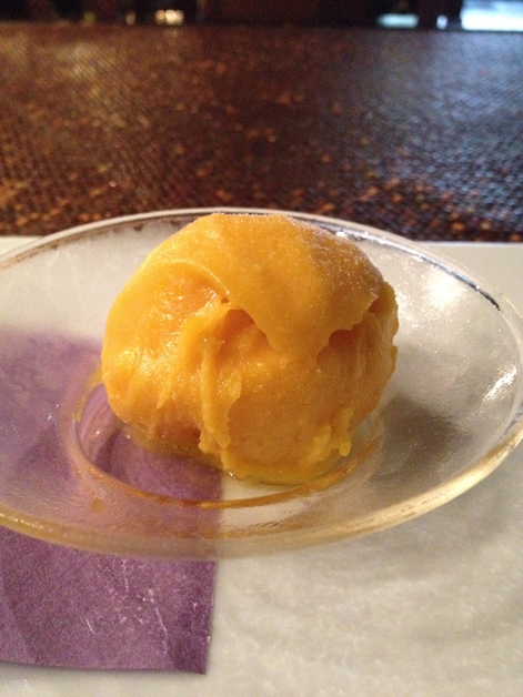 mango sorbet accompanying the passion fruit souffle at t8