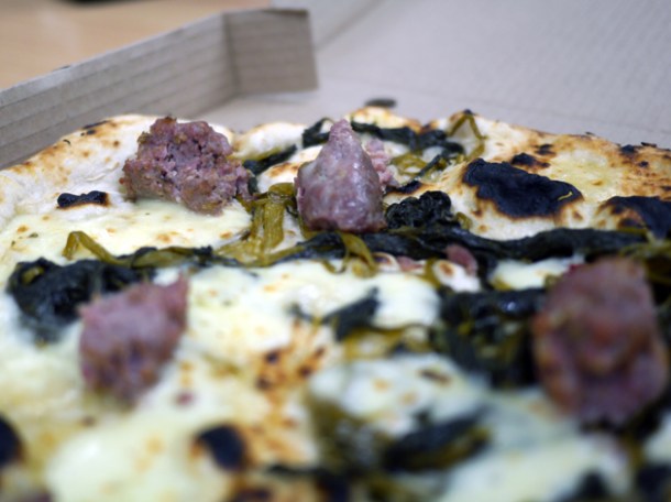 close up of broccoli, mozzarella and Gloucester old spot sausage pizza from franco manca
