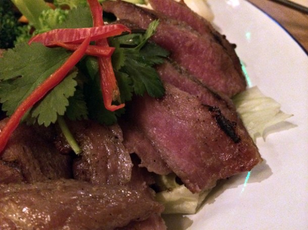 close up of grilled pork neck at rosa's cafe carnaby street