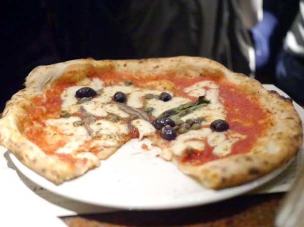 tomato, garlic, oregano, capers, olives, anchovies & mozzarella pizza at franco manca