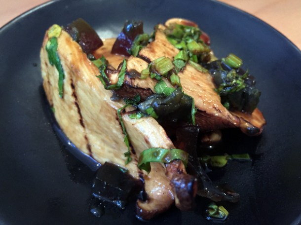 century egg pieces and mushrooms at bao