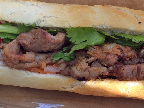 close up of grilled pork banh mi at new saigon cafe