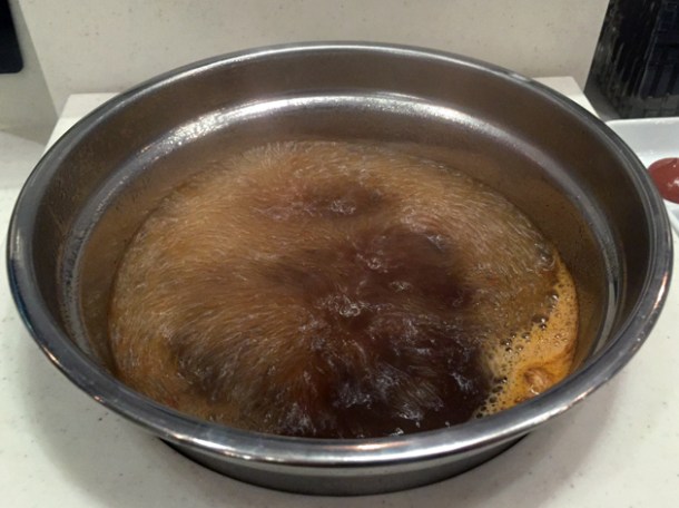 boiling mala chinese hotpot broth at shuang shuang