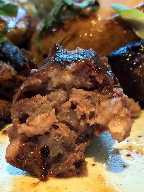 sliced barbecued sausage at bbq whisky beer at the grey horse kingston