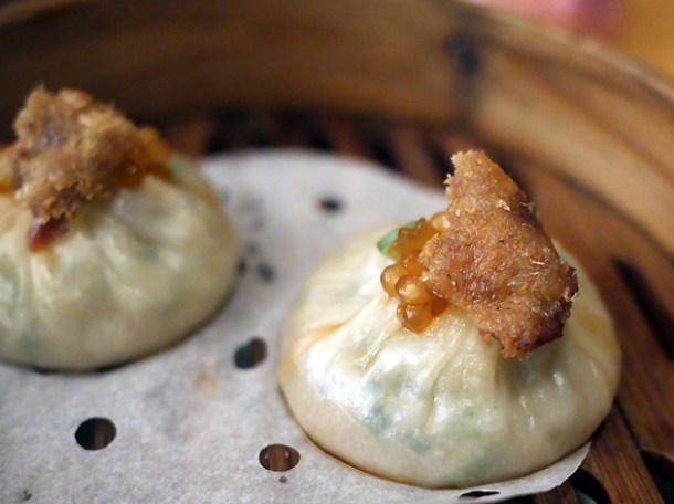 xiao long bao topped with crispy duck skin at a wong