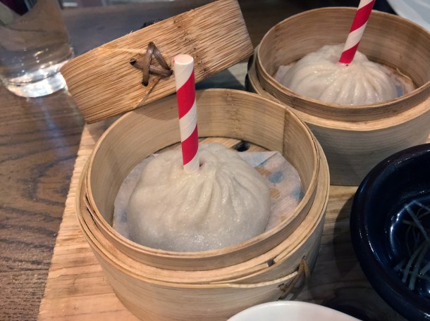 xiaolongbao soup dumplings with straws at Red Farm Covent Garden London