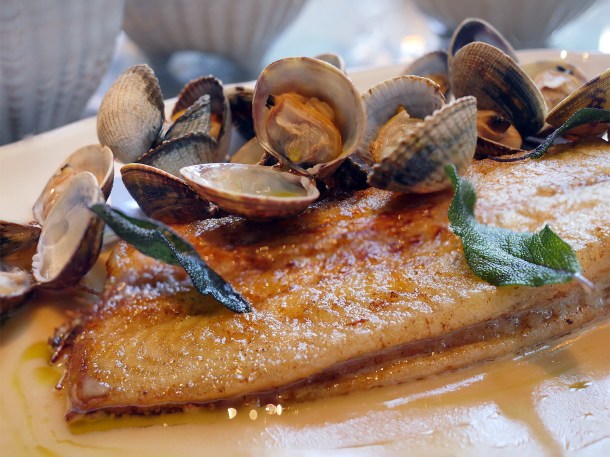 illustrative photo of the dover sole with cockles and clams in clotted cream sauce at Siren at The Goring Hotel