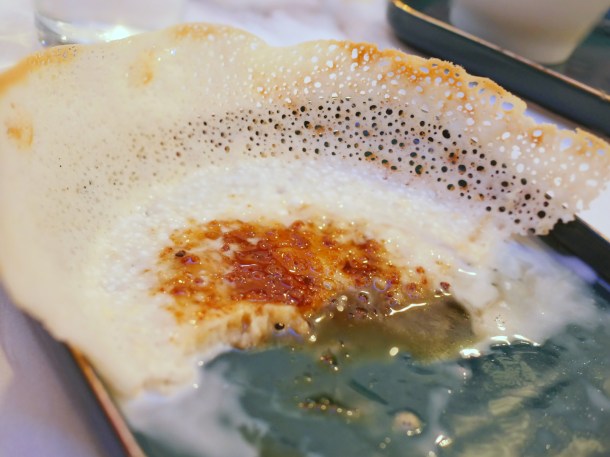 illustrative photo of the jaggery and coconut dessert hopper at colombo kitchen