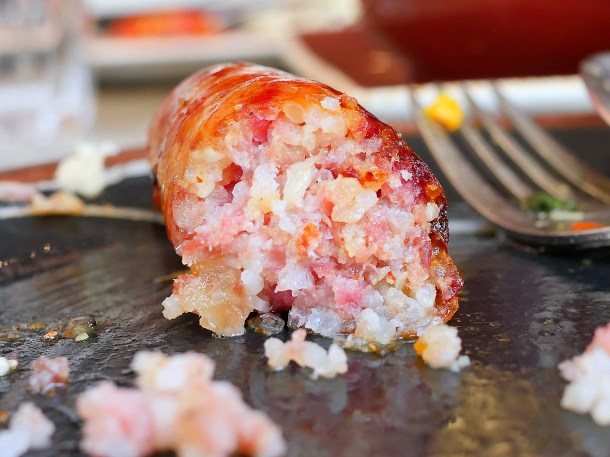 illustrative image of the halved fermented sausage at Lao Cafe