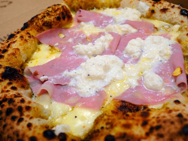 illustrative photo of the Golosa pistachio pesto, mortadella, ricotta and lemon pizza from O'ver Borough