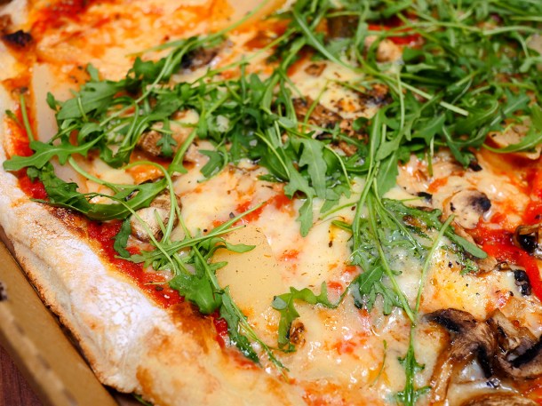 illustrative photo of the pear and blue cheese pizza from Caprini