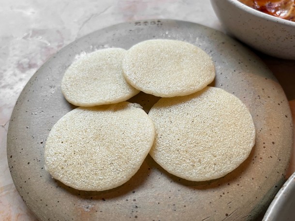 illustrative photo of the sinasir rice pancakes at Akara