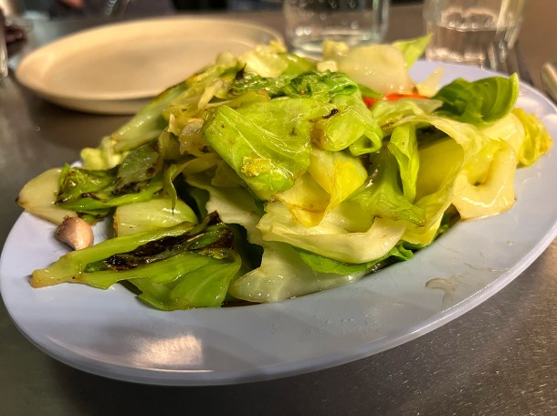 illustrative photo of the cabbage stir fried in pork fat at Singburi Shoreditch